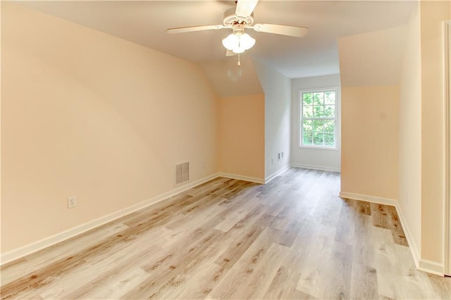 bonus room with ceiling fan, lofted ceiling, and light hardwood / wood-style flooring