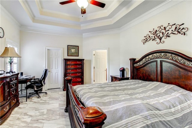 bedroom with a raised ceiling, ceiling fan, and ornamental molding