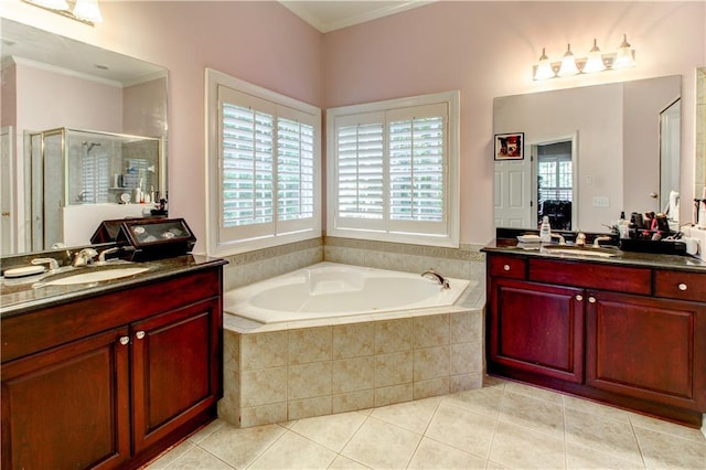 bathroom featuring tile patterned flooring, vanity, separate shower and tub, and ornamental molding