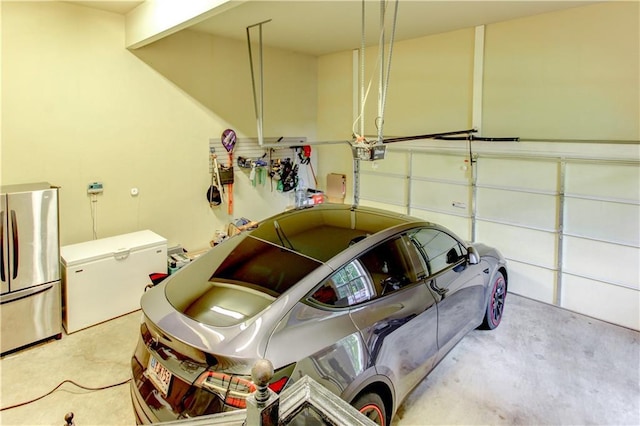 garage featuring refrigerator and stainless steel refrigerator