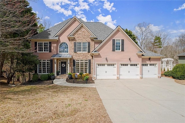 view of front facade featuring brick siding, a front lawn, concrete driveway, and a garage