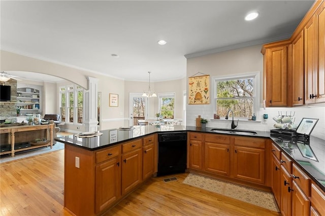 kitchen featuring a sink, black dishwasher, ornamental molding, and light wood finished floors