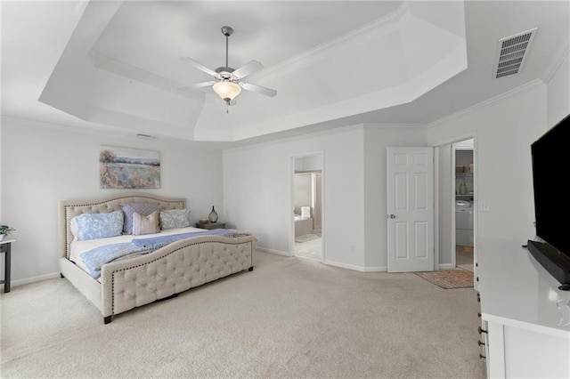 bedroom featuring visible vents, a raised ceiling, baseboards, and carpet flooring