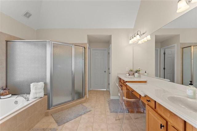 bathroom featuring visible vents, a sink, a shower stall, tile patterned flooring, and double vanity