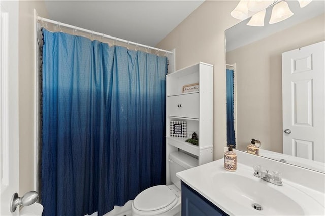 full bathroom featuring toilet, vanity, and a shower with curtain