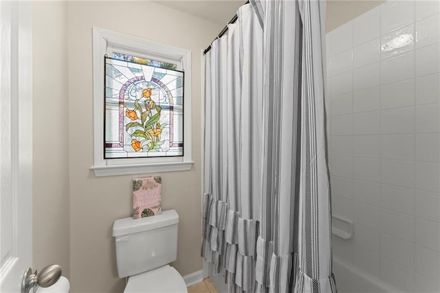 full bath featuring toilet and shower / tub combo with curtain