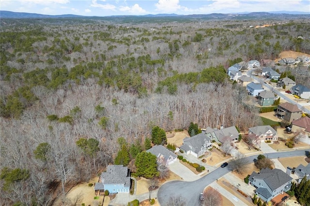 drone / aerial view featuring a residential view and a mountain view