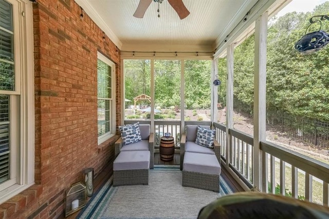 2439 Huntington Park Dr NW, Acworth, GA 30101 - sunroom with a ceiling fan and an outdoor hangout area