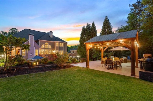 2439 Huntington Park Dr NW, Acworth, GA 30101 - yard at dusk with a gazebo and a patio area