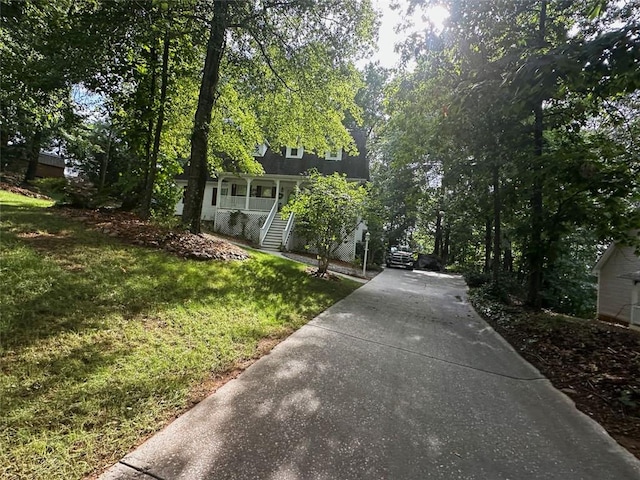 view of front of house with a front lawn and a porch