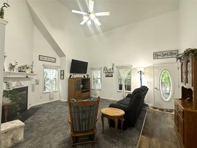 living room featuring high vaulted ceiling and ceiling fan