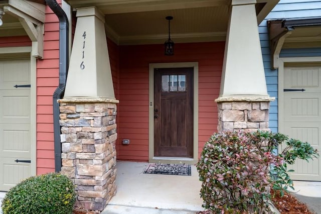 view of exterior entry featuring a garage