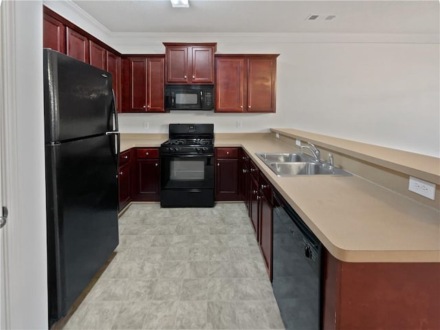 kitchen with a sink, dark brown cabinets, ornamental molding, light countertops, and black appliances