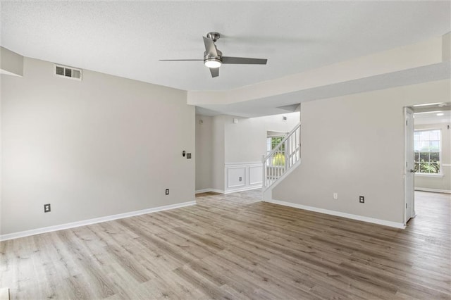 spare room featuring light hardwood / wood-style floors and ceiling fan