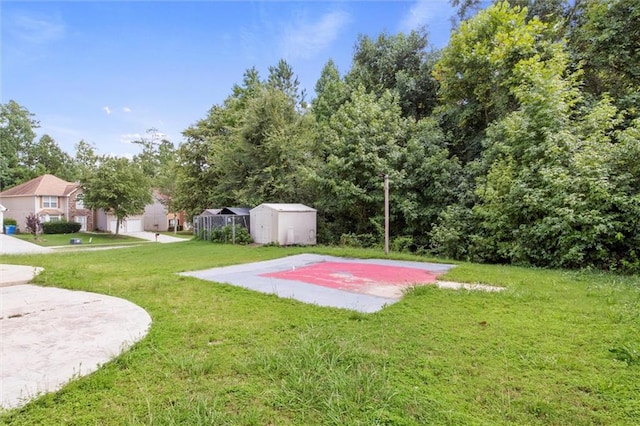 view of basketball court featuring a lawn