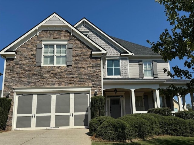 craftsman house with a garage