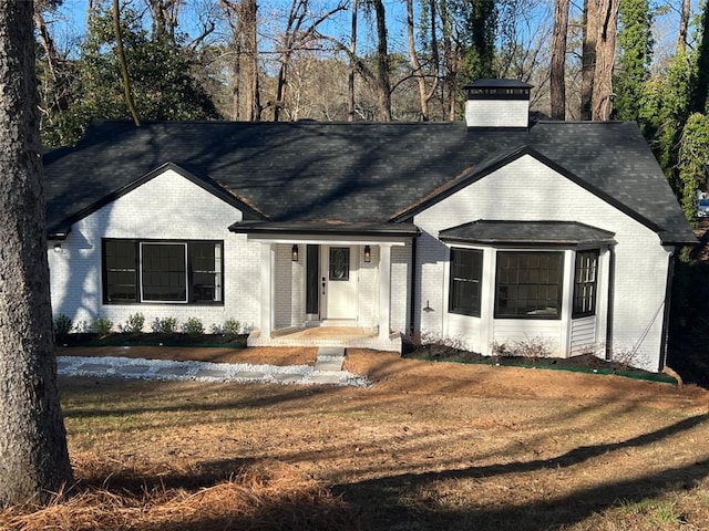 ranch-style house with a front lawn