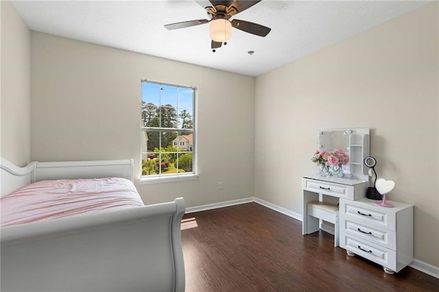bedroom featuring dark wood-style floors, baseboards, and a ceiling fan