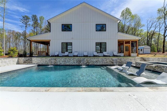 132 Swift Creek Way, Jefferson, GA 30549 - view of swimming pool with a patio, pool water feature, a hot tub, and a storage shed