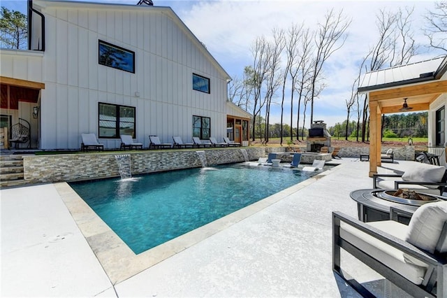 132 Swift Creek Way, Jefferson, GA 30549 - view of swimming pool featuring pool water feature, ceiling fan, a patio, and exterior fireplace
