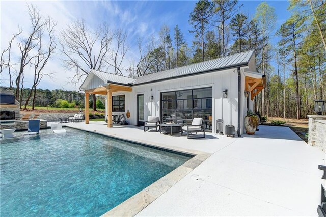 132 Swift Creek Way, Jefferson, GA 30549 - rear view of house featuring an outdoor living space with a fireplace, a patio area, and an outbuilding