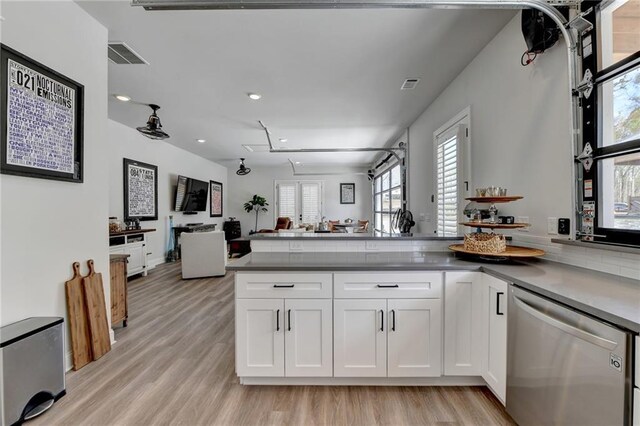 132 Swift Creek Way, Jefferson, GA 30549 - kitchen featuring kitchen peninsula, white cabinetry, dishwasher, and light hardwood / wood-style flooring