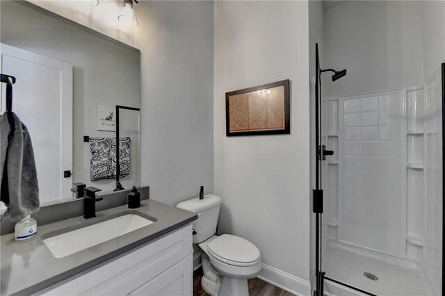 132 Swift Creek Way, Jefferson, GA 30549 - bathroom featuring a shower, vanity, wood-type flooring, and toilet
