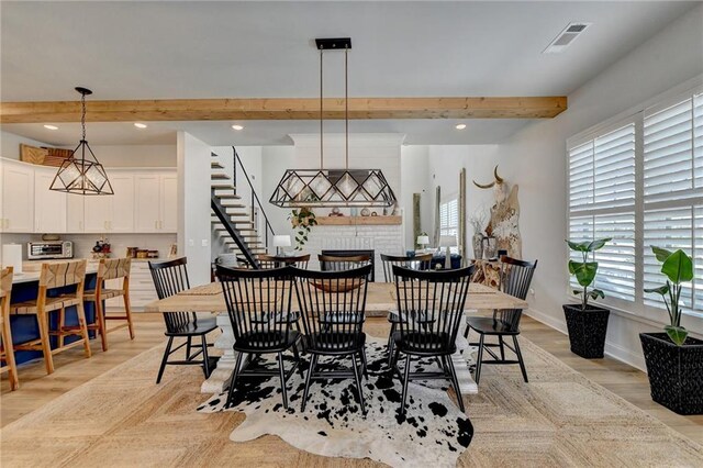 132 Swift Creek Way, Jefferson, GA 30549 - dining area featuring beam ceiling and light hardwood / wood-style flooring
