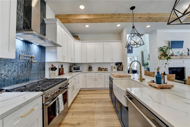 132 Swift Creek Way, Jefferson, GA 30549 - kitchen with beam ceiling, white cabinetry, appliances with stainless steel finishes, and wall chimney exhaust hood