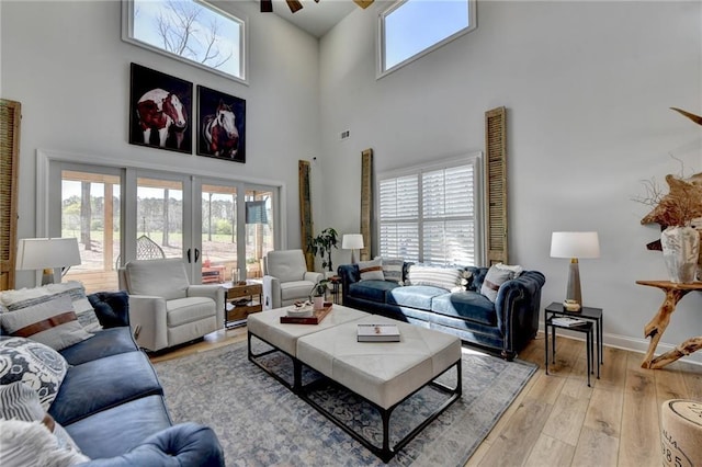132 Swift Creek Way, Jefferson, GA 30549 - living room featuring ceiling fan, french doors, light hardwood / wood-style floors, and a high ceiling
