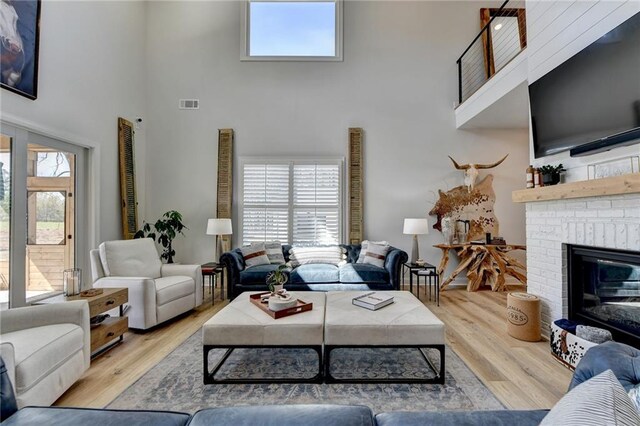 132 Swift Creek Way, Jefferson, GA 30549 - living room with plenty of natural light, light wood-type flooring, and a fireplace