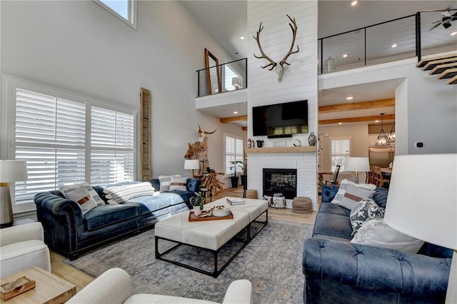 132 Swift Creek Way, Jefferson, GA 30549 - living room with a fireplace, a high ceiling, and plenty of natural light