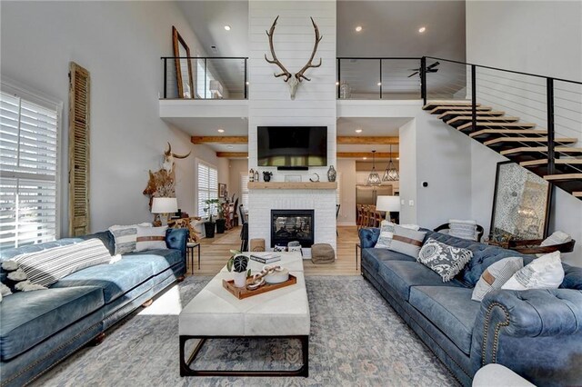132 Swift Creek Way, Jefferson, GA 30549 - living room with a fireplace, wood-type flooring, and a high ceiling