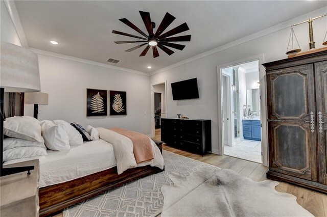 132 Swift Creek Way, Jefferson, GA 30549 - bedroom with connected bathroom, ceiling fan, ornamental molding, and light wood-type flooring