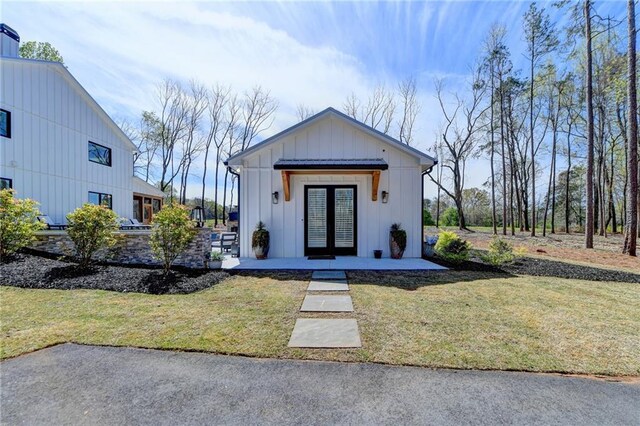 132 Swift Creek Way, Jefferson, GA 30549 - view of front facade featuring a front lawn and french doors