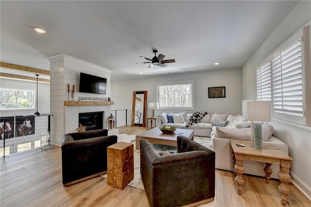 132 Swift Creek Way, Jefferson, GA 30549 - living room with ceiling fan, plenty of natural light, light wood-type flooring, and a fireplace