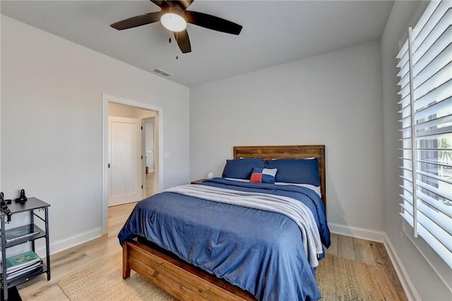 132 Swift Creek Way, Jefferson, GA 30549 - bedroom with multiple windows, ceiling fan, and light wood-type flooring