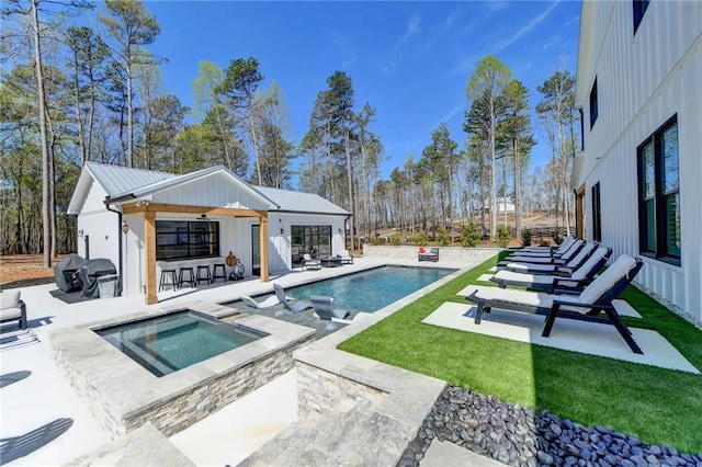 132 Swift Creek Way, Jefferson, GA 30549 - view of swimming pool with grilling area, a patio area, an in ground hot tub, an outbuilding, and a bar