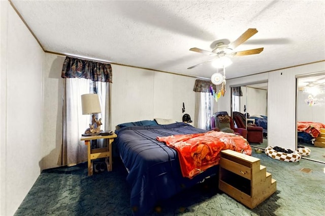 carpeted bedroom featuring crown molding, ceiling fan, and a textured ceiling