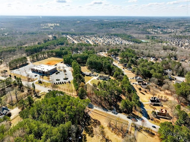 drone / aerial view featuring a view of trees