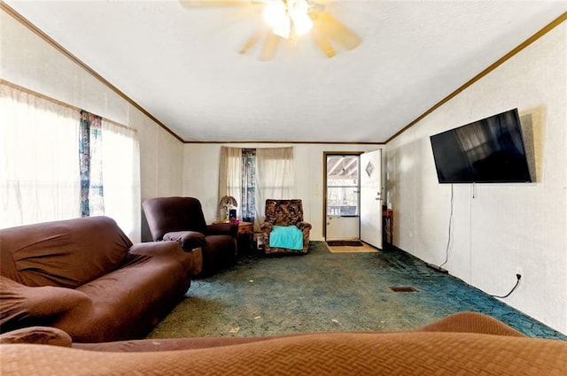 living room with lofted ceiling, carpet floors, a ceiling fan, and crown molding