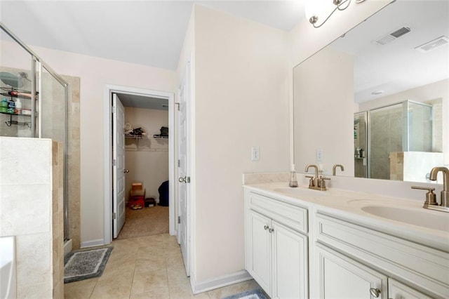 full bathroom with a stall shower, visible vents, and a sink