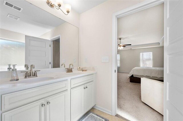 ensuite bathroom featuring ensuite bathroom, a sink, and visible vents