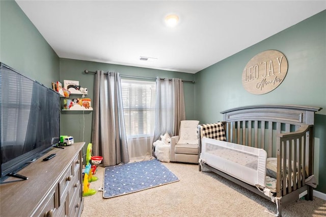 carpeted bedroom featuring a nursery area, baseboards, and visible vents