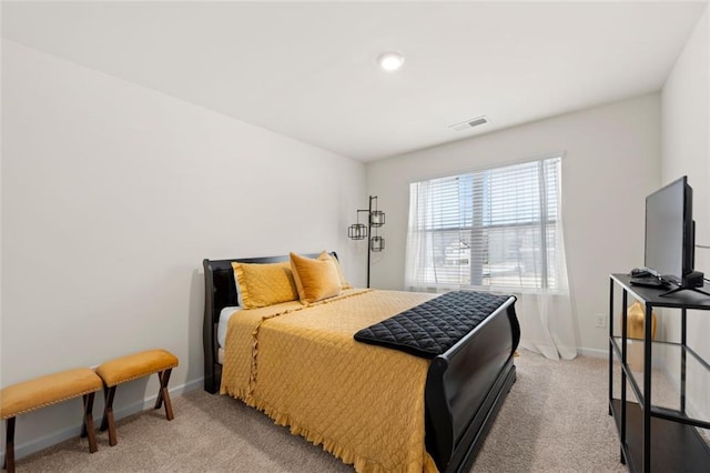 bedroom featuring light carpet, baseboards, and visible vents