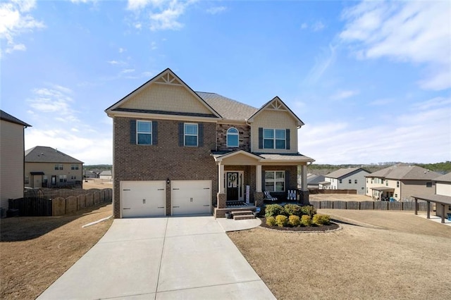 craftsman-style home with driveway, an attached garage, fence, and brick siding