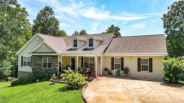 cape cod house with a front lawn and a porch