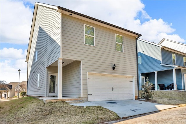 view of front of property with a garage and a front yard