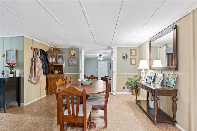 dining area with baseboards and a ceiling fan