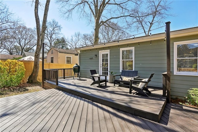 wooden terrace with grilling area and fence